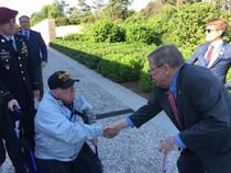 06-06-19 JHI shakes hand of WWII veteran.jpg